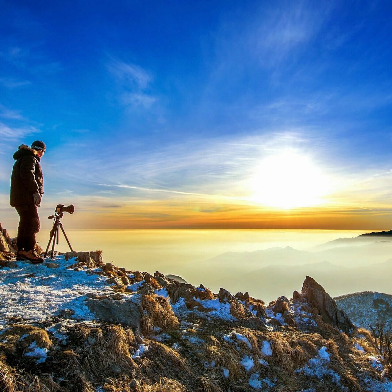 a photographer shooting on the mountains
